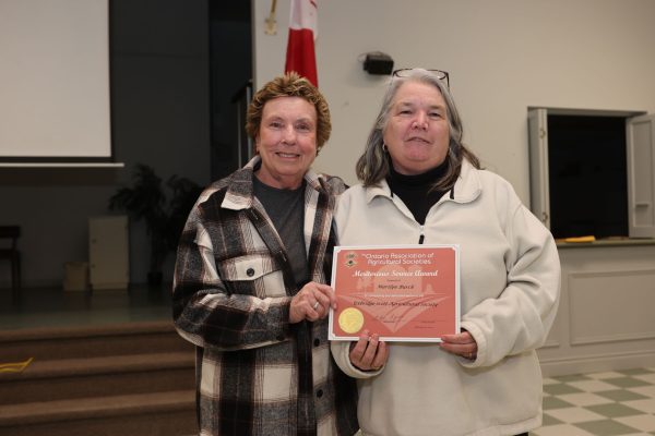 Bev Latva presents Marilyn Burch with the Meritorious Service Award