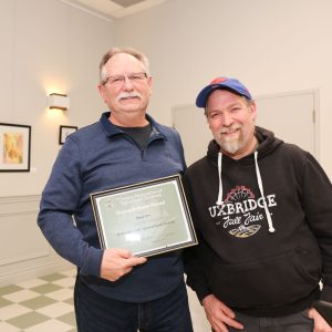 Brad Orr receives Achievement Award certificate from Rob Ashton at Uxbridge Fair AGM