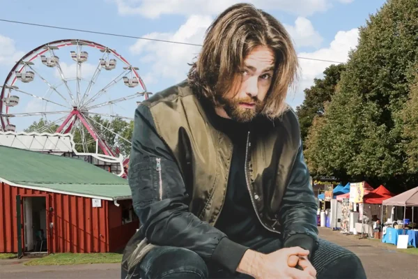 Scott Jackson, Canadian beatbox champion, at the Uxbridge Fair fairgrounds with the midway Ferris wheel in the background.