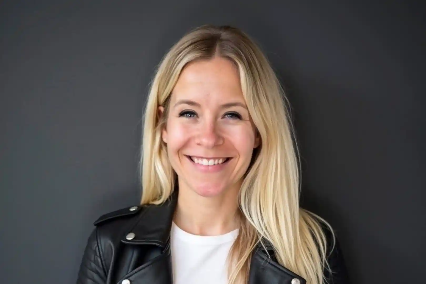 Tara Acton, line dancing instructor with Step In Time Country, smiling in a headshot photo